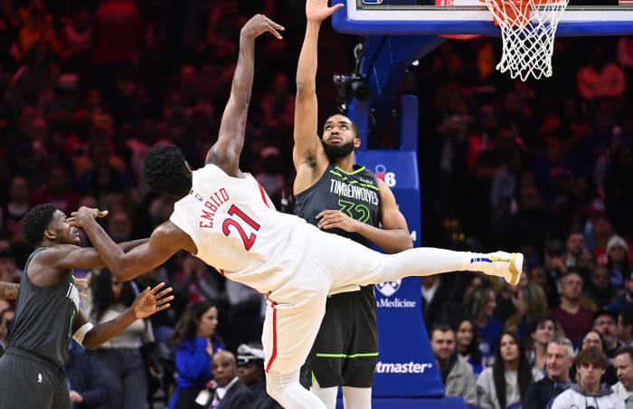 Nov 19, 2022; Philadelphia, Pennsylvania, USA; Philadelphia 76ers center Joel Embiid (21) shoots against Minnesota Timberwolves center Karl-Anthony Towns (32) in the second quarter at Wells Fargo Center.
